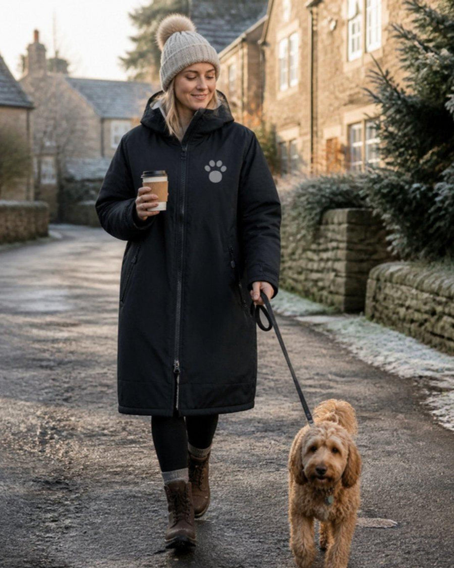 Black and cream Pooch All Season Robe on a village walk