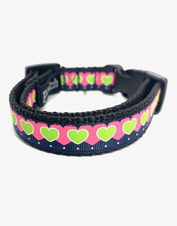 Adjustable hearts dog collar with durable clip and stainless steel D-rings.