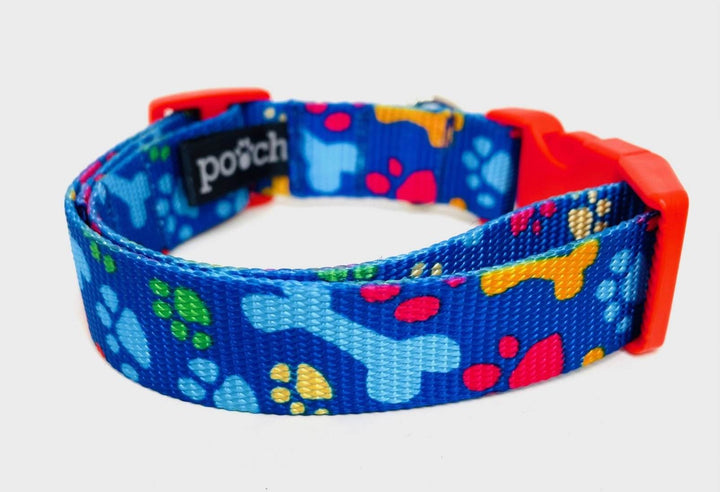 Handmade Paw Prints and Bones Dog Collar with playful design on blue webbing.