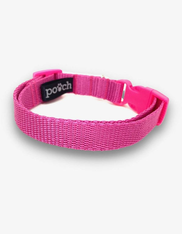 Adjustable pink dog collar with durable clip and stainless steel D-rings.