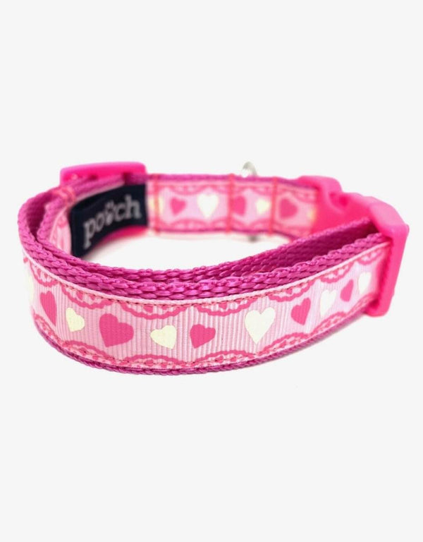 Pink hearts adjustable dog collar with durable clip and stainless steel D-rings.