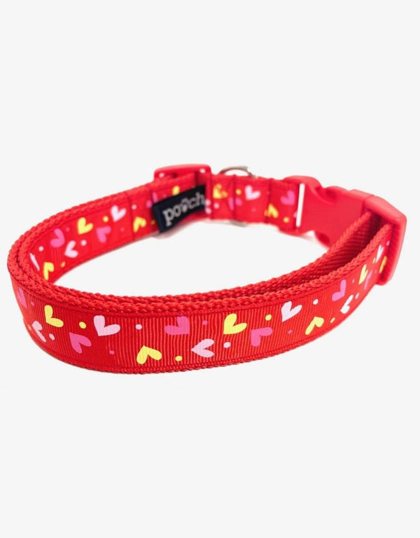 Red Hearts Dog Collar with colorful heart pattern, durable stainless steel D-ring, and robust plastic clip.
